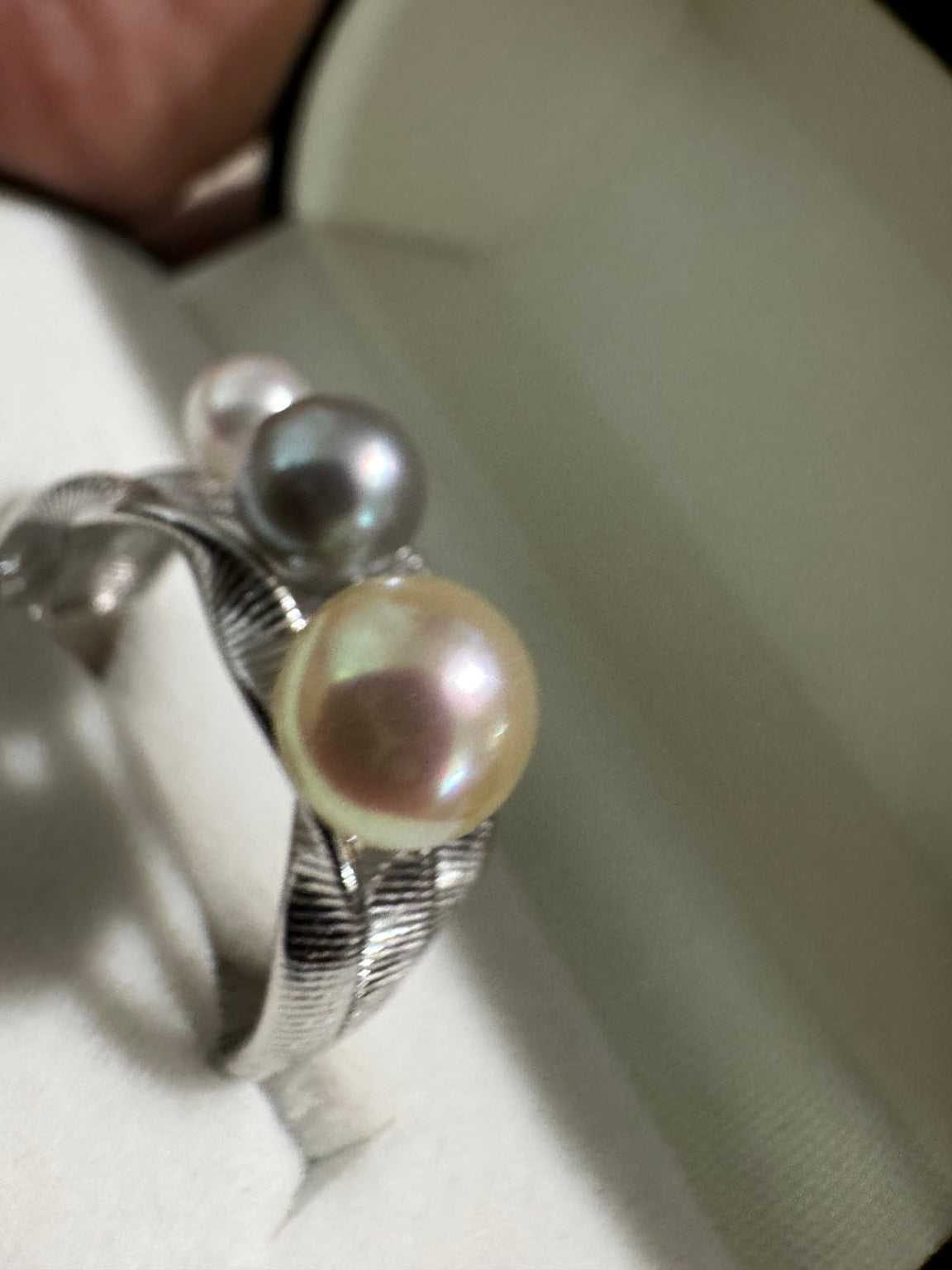 Close-up of feather gold Akoya pearl on PEM Expressions S925 adjustable ring