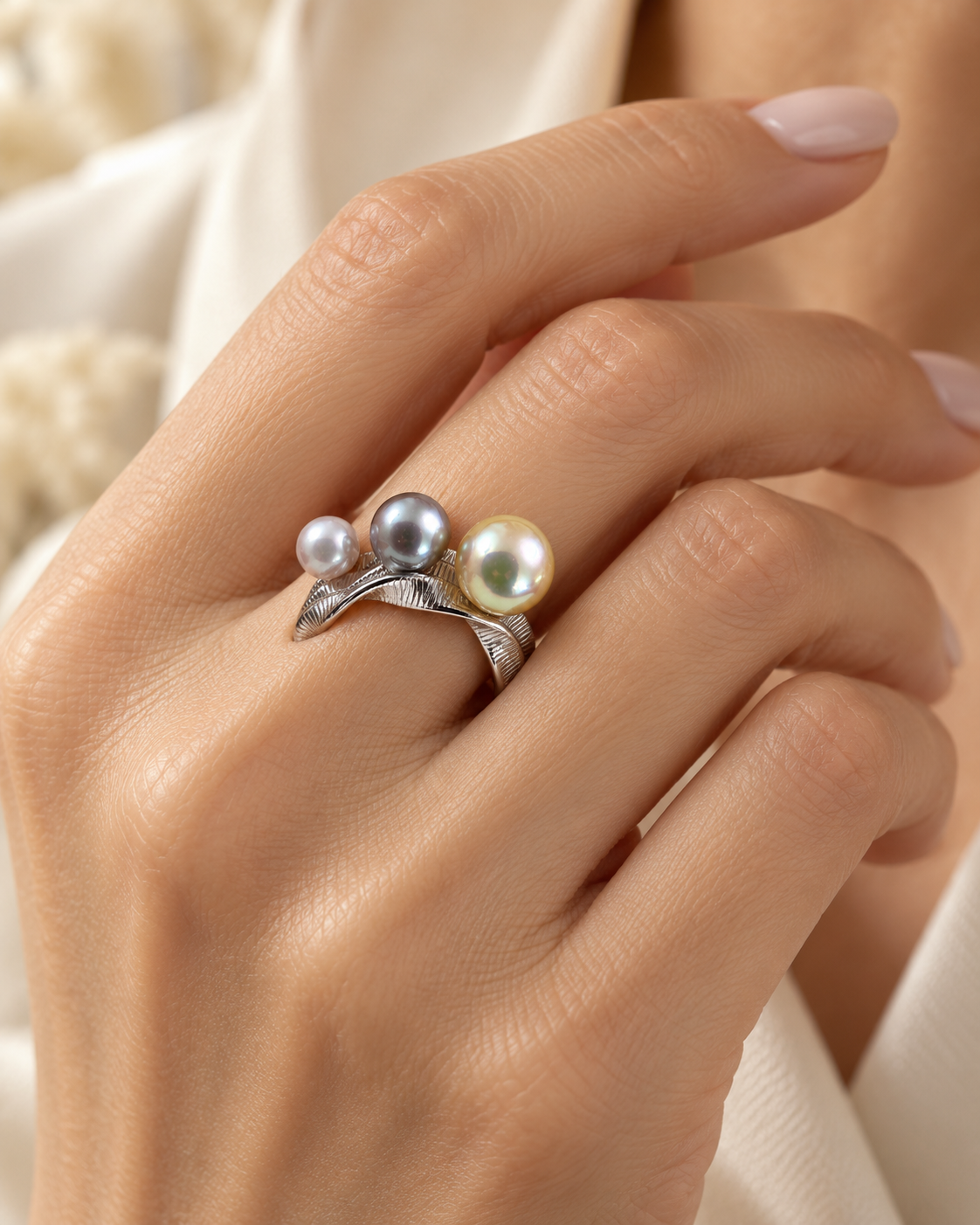Model wearing PEM Expressions Trio Akoya Pearl adjustable sterling silver ring